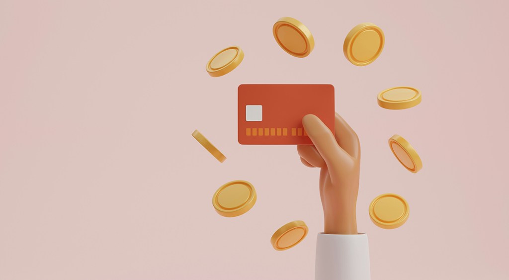 An illustrated image with a pink background. A hand comes from the bottom of the image on the right of centre, holding a credit card and surrounded by a circle of gold coins
